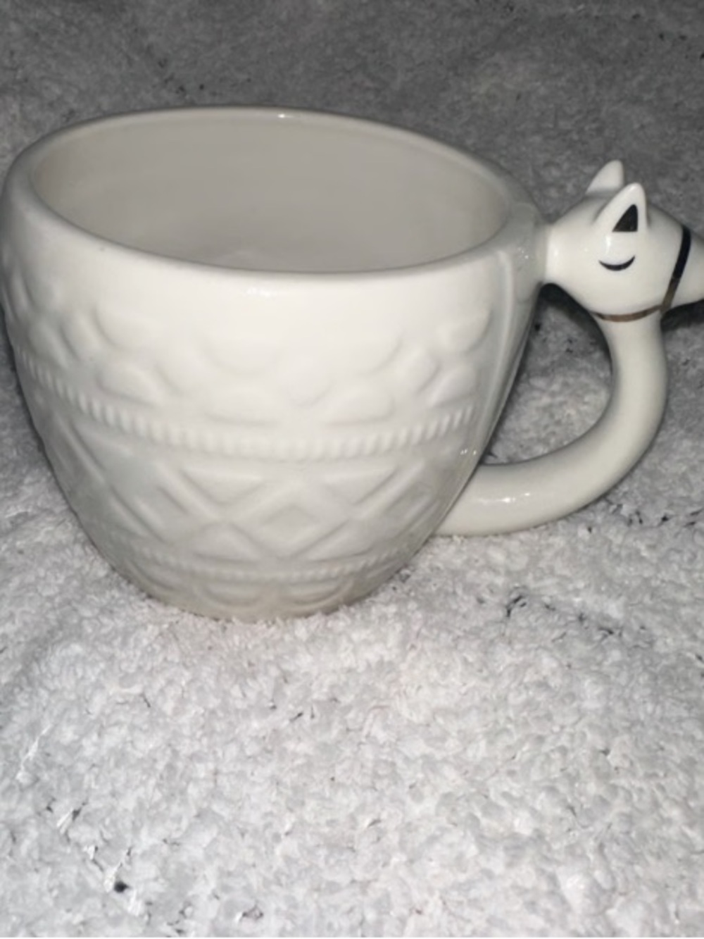 White Ceramic Cat-Handle Mug with Textured Pattern